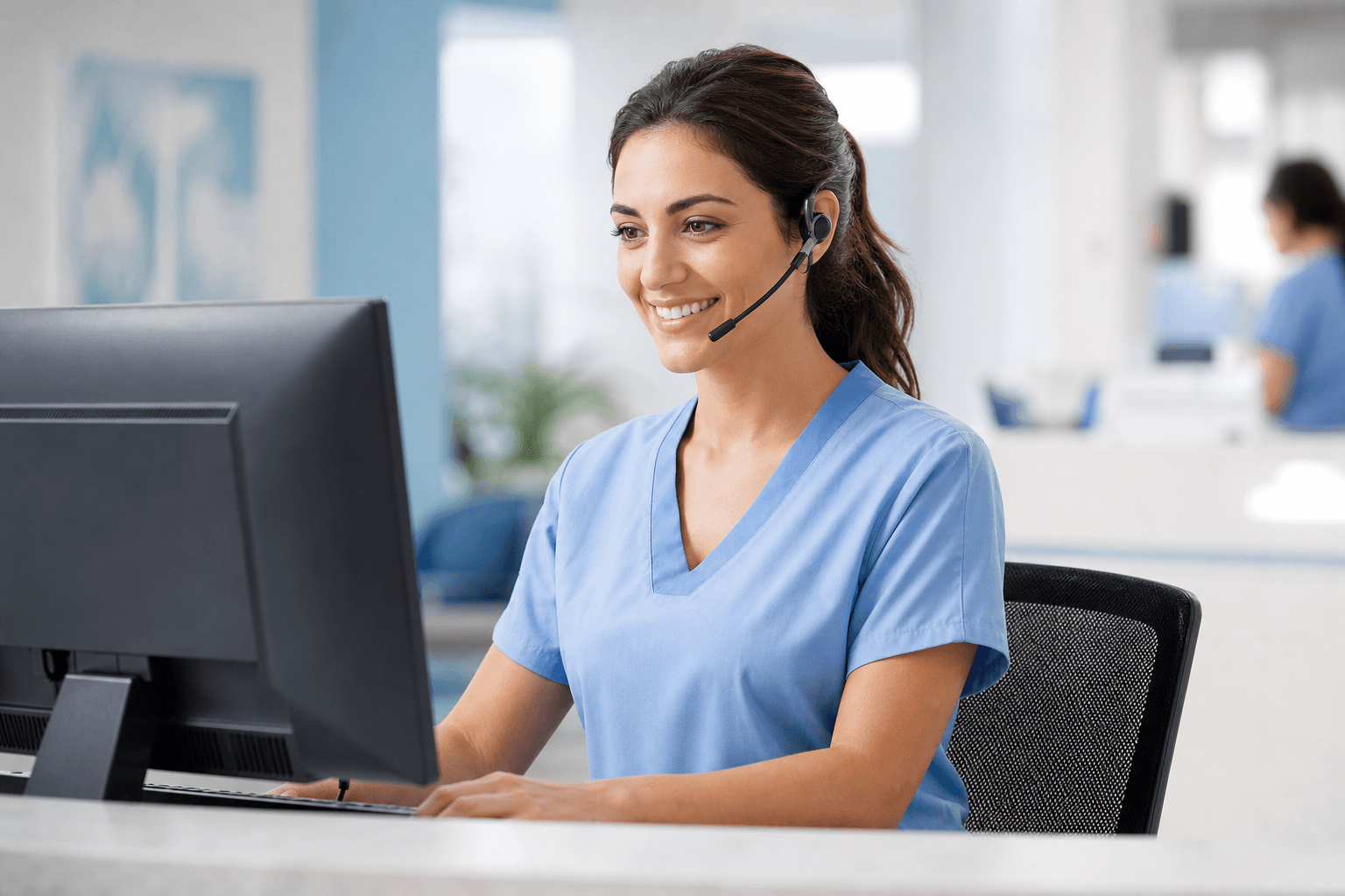 Patient-access coordinator booking an appointment on a headset