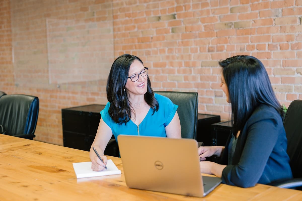 Notary and client reviewing documents in a meeting